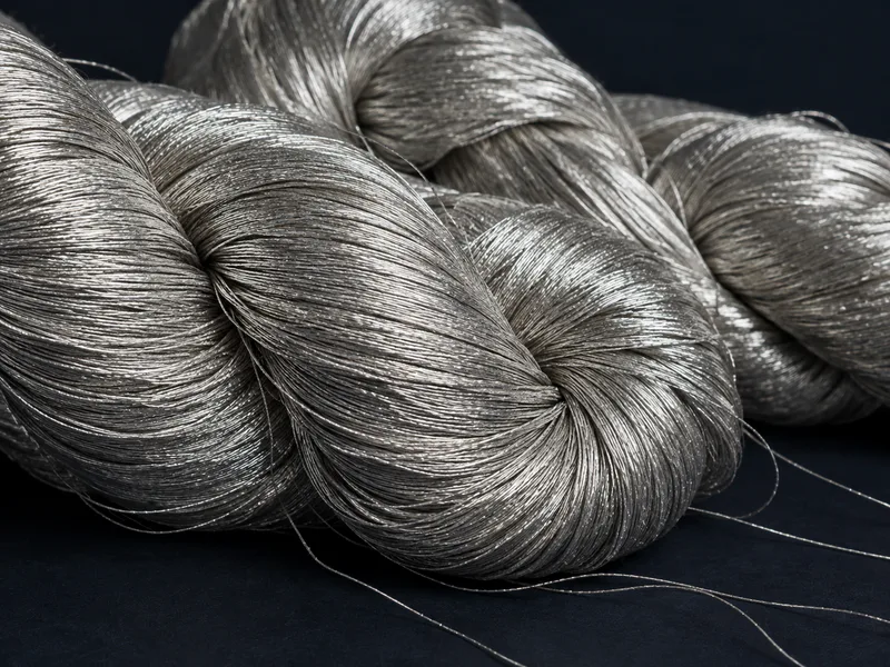 Close-up of clean silver metallic zari yarn skeins